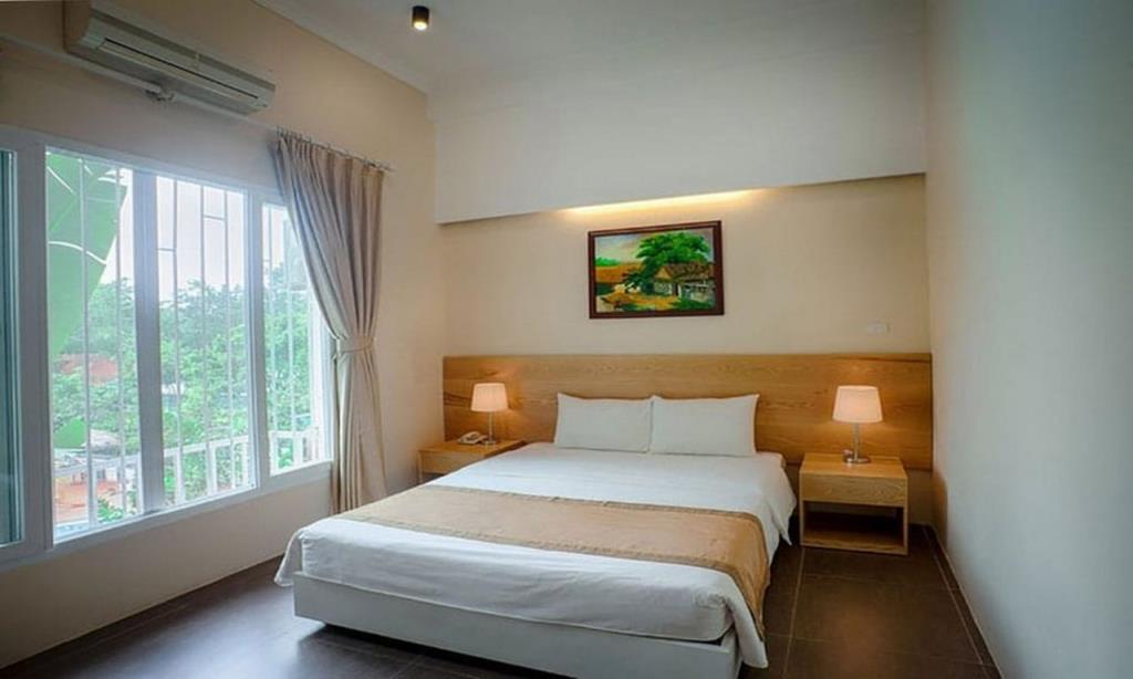 Phòng 1 Giường Lớn Hoặc 2 Giường Đơn Hướng Núi - Khu Sư Tử - VResort Hòa Bình