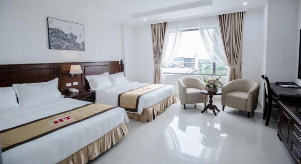 Phòng Deluxe 2 Giường Lớn Hướng Phố - Khách Sạn Hoàng Thái Sầm Sơn