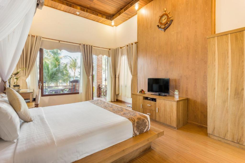 Phòng Deluxe có Giường cỡ king - Nhìn ra Bãi biển - Gold Coast Phu Quoc Beach Resort