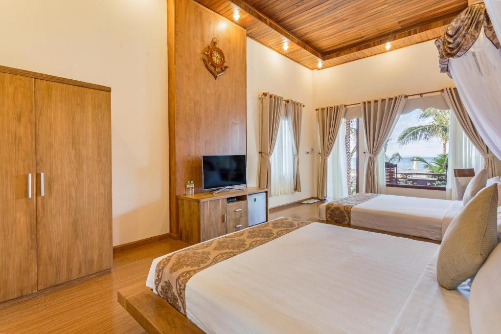 Phòng Deluxe 2 Giường Đơn - Nhìn ra Bãi biển - Gold Coast Phu Quoc Beach Resort